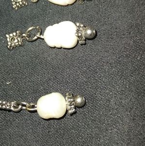 Real pearls with silver brackets